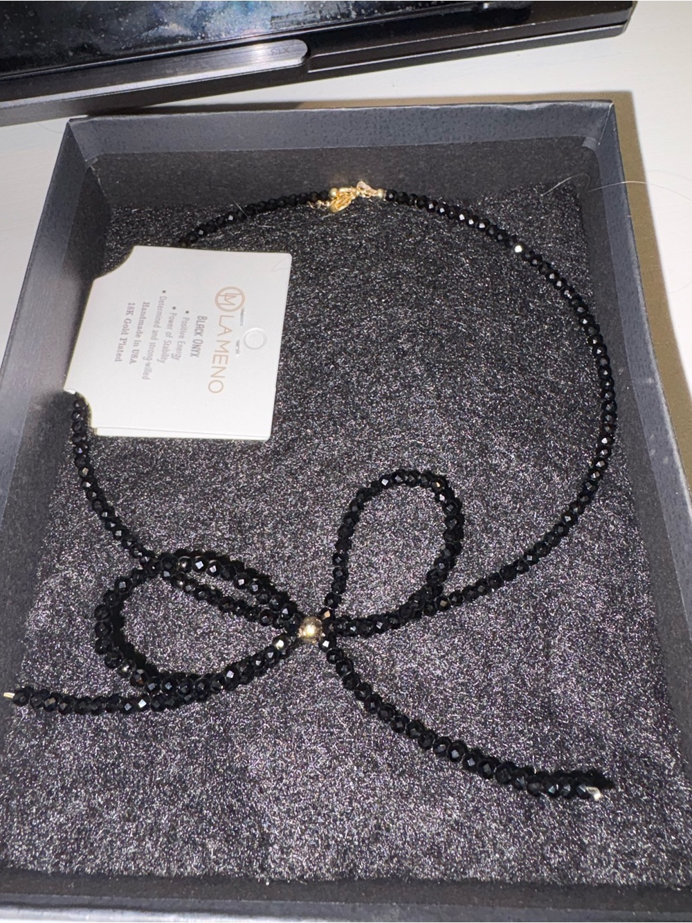 Black Beaded Bow Necklace with Gold Accent